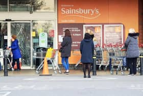 People observe social distancing while queuing at a Sainsbury's supermarket at Colton, on the outskirts of Leeds, the day after Prime Minister Boris Johnson put the UK in lockdown to help curb the spread of the coronavirus. Picture: Danny Lawson/PA Wire