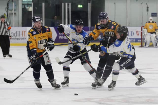 Sheffield Steeldogs' Alex Graham (21) battles with Leeds Chiefs' Steven Moore, right and Liam Charnock. Picture courtesy of Cerys Molloy.