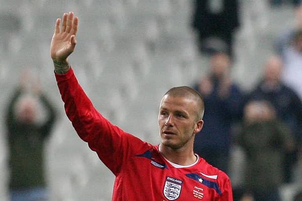 Milestone: England's David Beckham waves to the fans as he is substituted on his 100th appearance. Picture: Martin Rickett/PA