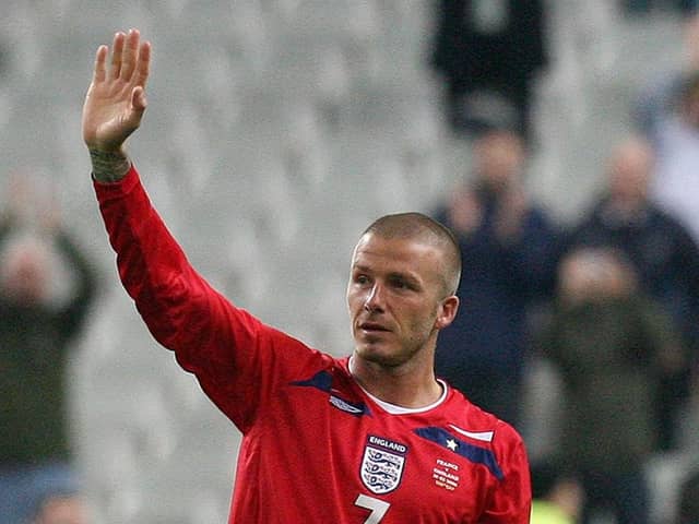 Milestone: England's David Beckham waves to the fans as he is substituted on his 100th appearance. Picture: Martin Rickett/PA