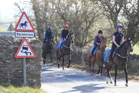 Racehorses at the gallops in Middleham. Trainers are being advised to continue gallops exercise, and adhere strictly to social-distancing requirements, following Prime Minister Boris Johnson's announcement of new measures to combat the spread of coronavirus. PA Photo.