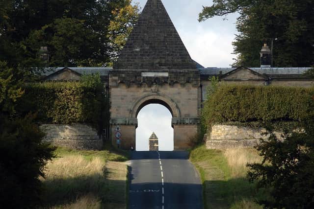 The Gatehouse of Castle Howard, originally called the Pyramid Arch, built by Vanbrugh in 1719, frames the Obelisk that was built in 1714 .

picture mike cowling