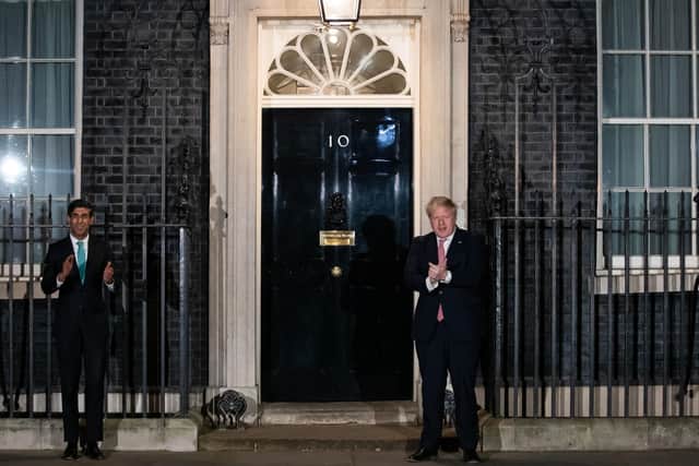 Prime Minister Boris Johnson (right) and Chancellor Rishi Sunak outside 10 Downing Street, London, joining in with a national applause for the NHS to show appreciation for all NHS workers who are helping to fight the Coronavirus. Twleve hours later, the PM confirmed that he has Covid-19.