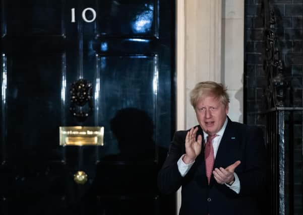 Prime Minister Boris Johnson outside 10 Downing Street, London, joining in with a national applause for the NHS to show appreciation for all NHS workers who are helping to fight the Coronavirus.