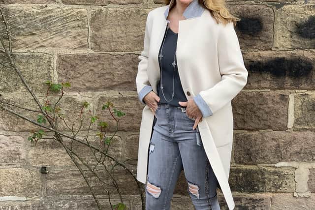 Fiona Martin models: Cream coat with grey trim, £95; V neck top with bell sleeves, £29; silver sparkle side-stripe jeans, £36; flower motif silver necklace, £24; cream ankle boots, £29. All at BestKeptSecretClothing.co.uk.