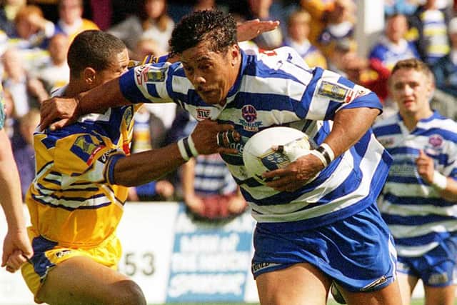 Halifax's Mike Umaga brushes aside the Leeds defence to score.