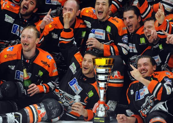 Jonathan Phillips, centre, celebrates winning the Challenge Cup against Cardiff. Picture: Dave Williams/EIHL.