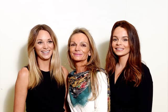 Joanne Wilkinson (centre) with daughters Hana and Fleur (right and left).