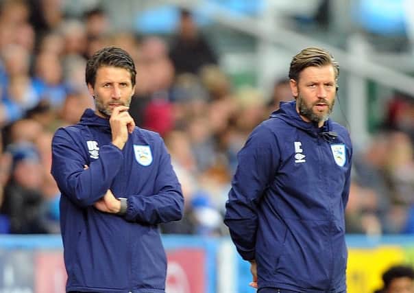 Brothers in arms: Huddersfield's joint managers Danny, left, and Nicky Cowley.