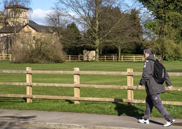 Ready to move: Leeds United coach Marcelo Bielsa outside the current training headquarters.