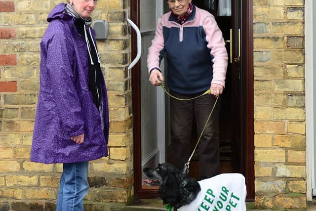 Keep Your Pet volunteer Diane Roberts with dog owner Phyllis Woodwarrd pictured in 2016. The charity has now introduced social distancing measures so it can continue its work through the coronvirus outbreak. Picture Scott Merrylees