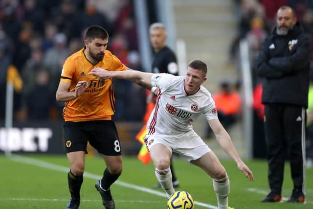 Sheffield United's John Lundstram in action for Wolves' Ryben Neves, the Midlanders being one of the Blades' key rivals for European qualification. Picture: Bradley Collyer/PA