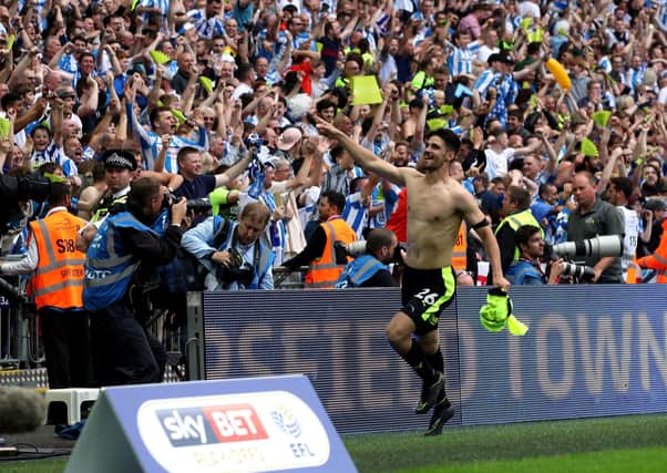Inspiring: Huddersfield Town's Christopher Schindler celebrates winning the penalty shoot-out in the Championship play-off final against Reading at Wembley. Picture: Nick Potts/PA
