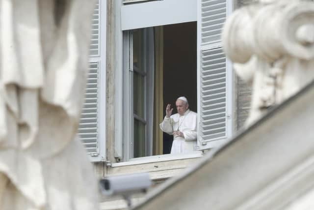 Pope Francis delivers his blessing from the window of his studio overlooking an empty St.Peter's Square due to restrictions to contain the Covid-19 virus, at the Vatican on Sunday - Dr Nick Summerton recommends opening a window each day.