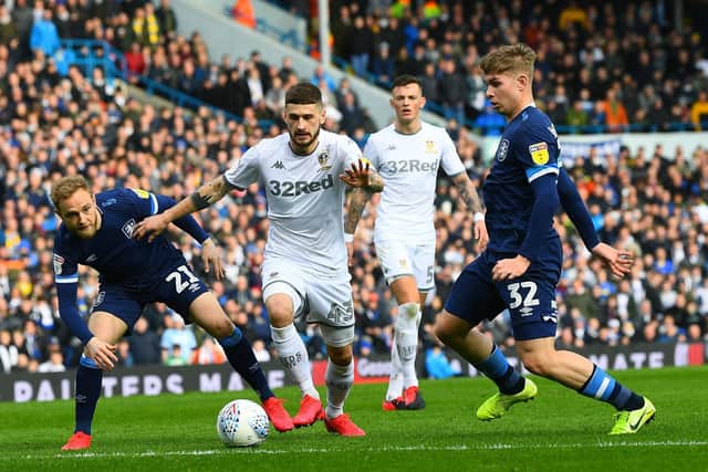 BRING IT BACK: Leeds United's Mateusz Klich takes on Town's Slex Pritchard and Emile Smith Rowe.
 Picture Jonathan Gawthorpe.