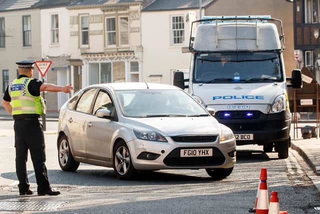 Photo dated March 26 of police at a vehicle checkpoint in York where officers from North Yorkshire Police were ensuring that motorists and their passengers are complying with government restrictions. Photo: PA