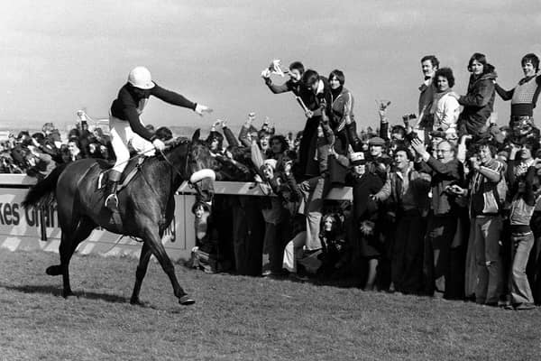 Red Rum and Tommy Stack gallop into the Grand National record books on April 2, 1977.