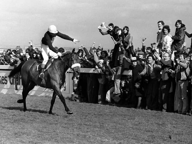 Red Rum and Tommy Stack gallop into the Grand National record books on April 2, 1977.