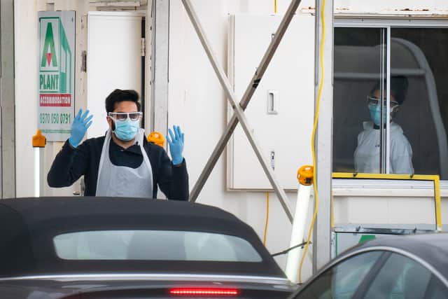 Medical staff at an NHS drive through coronavirus disease (COVID-19) testing facility as the UK continues in lockdown to help curb the spread of the coronavirus.