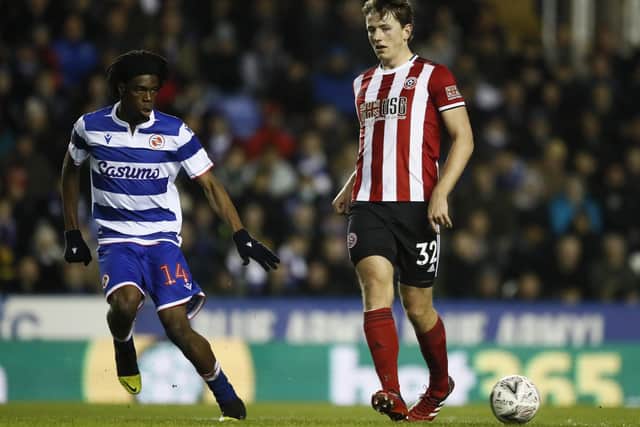 HOME ALONE: Sheffield United's Sander Berge passes the ball under pressure from Reading's Ovie Ejaria. Picture: Simon Bellis/Sportimage
