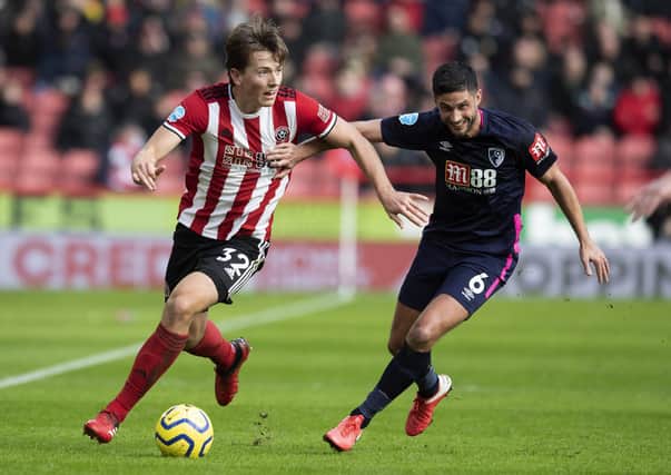 Sheffield United's Sander Berge holds off Bournemouth's Andrew Surman during their recent Premier league clash at Bramall Lane. Picture: Simon Bellis/Sportimage