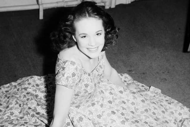 Leeds, 26th May 1954:  A then unknown teenage prodigy, Julie Andrews poses at the Grand Theatre in Leeds where she is in the play Mountain of Fire.