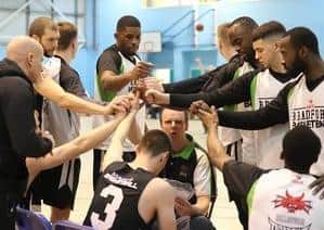 Holding court: Bradford Dragons coach Chris Mellor, centre, talks to his players during a timeout. (Picture: Alex Daniel)