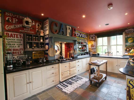 The kitchen with its collection of vintage signs