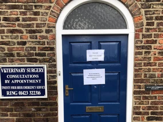 The door to Julian Norton's surgery is shut with routine procedures cancelled.