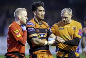 Castleford Tigers doctor Nick Raynor (left) and physio Matty Crowther (right) carry Jesse Sene-Lefao off with an injury. Picture: Allan McKenzie\SWpix.com.