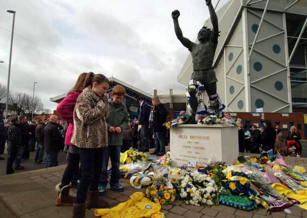 Never forgotten: Leeds United fans gather to remember Kevin Speight and Christopher Loftus at the Bremner statue in 2010. Tomorrow marks the 20th anniversary of their deaths.