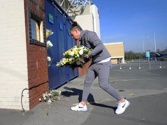 TRIBUTE: Leeds United midfielder Kalvin phillips lays flowers in front of the Elland Road plaque to Kevin Speight and Chris Loftus