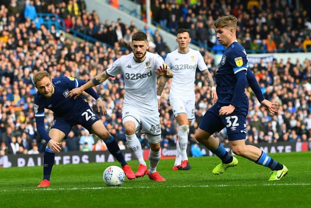 Leeds United's Mateusz Klich takes on Town's Slex Pritchard and Emile Smith Rowe.
 (Picture: Jonathan Gawthorpe
)