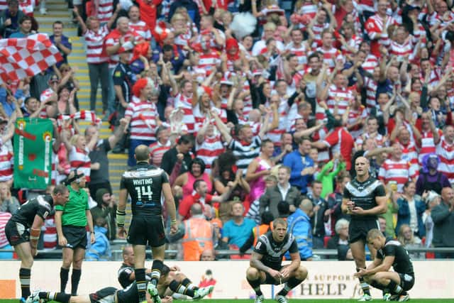 TOUGH DAY: Gareth Ellis, second right, shows his disappointment during Hull FC's 2013 Challenge Cup final defeat to Wigan. Picture: Bruce Rollinson