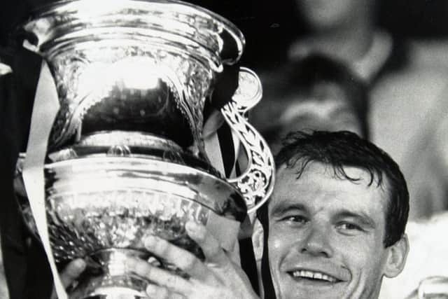MAGIC MOMENT: Castleford's John Joyner holds aloft the Challenge Cup trophy at Wembley in 1986.