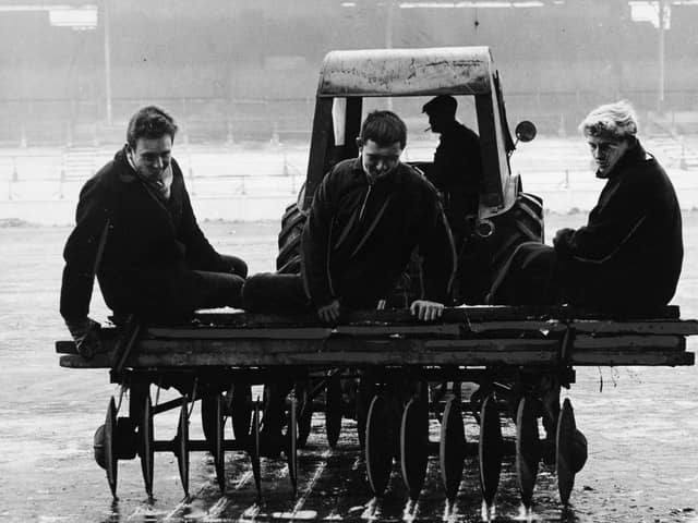 Ice-breaker: Leeds United use a motor-propelled disc-harrow on the Elland Road pitch in 1963.