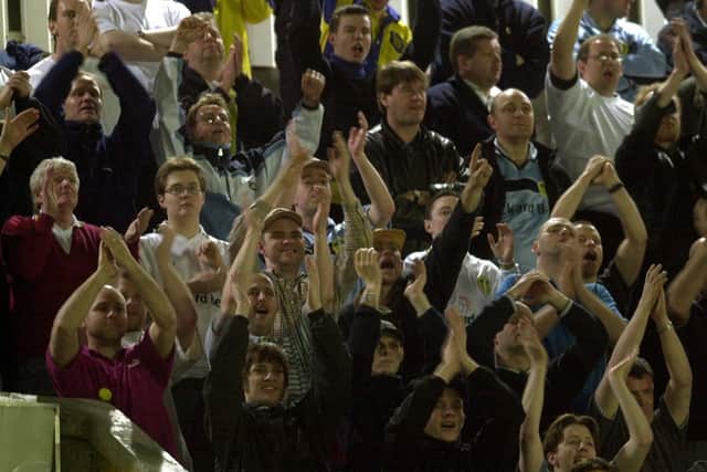 Well done: Leeds United fans applaud their team after the match against Galatasaray.