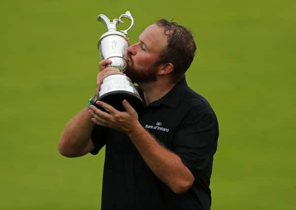 Shane Lowry celebrates winning the Claret Jug and The 2019 Open Championship at Royal Portrush Golf Club. Picture: Niall Carson/PA