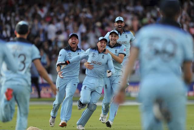 England's Jos Buttler, center, celebrates with team-mates after the dismissal of New Zealand's Martin Guptill in the World Cup final at Lord's last year. Picture: AP/Aijaz Rahi