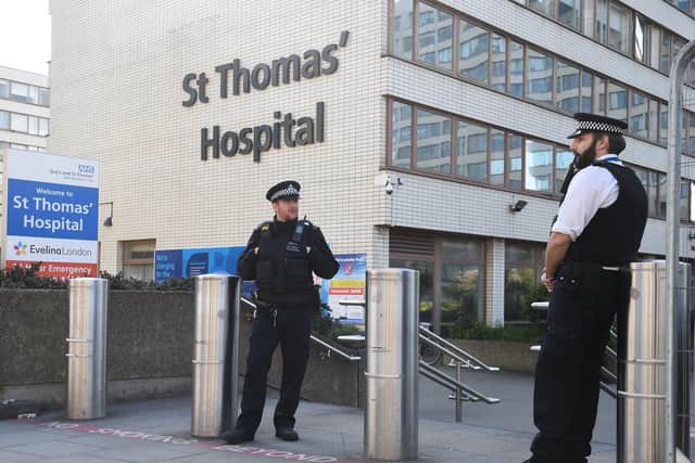 Police officers outside St Thomas' Hospital in Central London where Prime Minister Boris Johnson is in intensive care as his coronavirus symptoms persist. Photo: PA