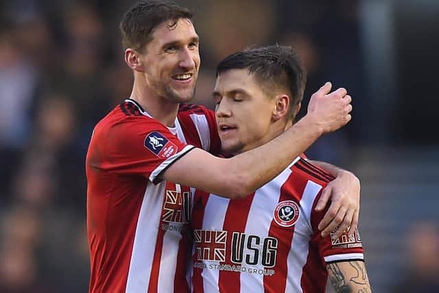 Chris Basham of Sheffield Utd hugs first goal scorer Muhamed Besic of Sheffield Utd after his goal in the FA Cup at Millwall (Picture:Robin Parker/Sportimage)