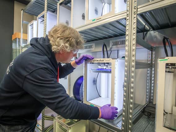 Nathan Brown, Senior Lecturer in Mechanical Engineering, at the University of Hull, works with a bank of 3D-printers producing 3D-printed faceguards to help health service staff tackle coronavirus. PA Photo.