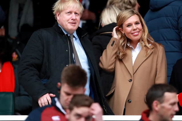 Boris Johnson and his partner Carrie Symonds at a Six Nations game before the Covid-19 crisis developed.