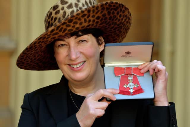 Joanne Harris holding her MBE for services to Literature after it was presented to her by Queen Elizabeth II at an Investiture Ceremony at Buckingham Palace Picture: John Stillwell/PA Wire