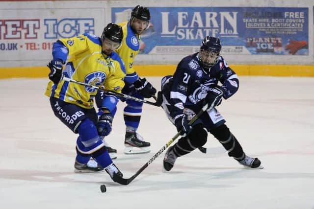 MAKING AN IMPRESSION: Alex Graham battles with 
Leeds Chiefs' forward Radek Meidl for Sheffield Steeldogs during a NIHL National clash last season. 
Picture courtesy of Cerys Molloy