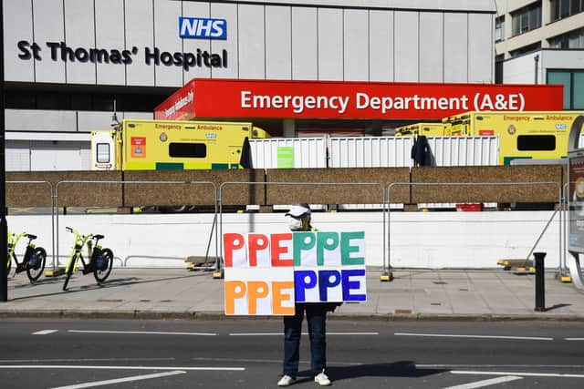 A PPE protester outside St Thomas' Hospital where Boris Johnson was treated for Covid-19.