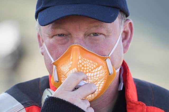 A man wears a face mask during the moorland fire at Saddleworth Moor, June 2018. Picture: Danny Lawson/PA