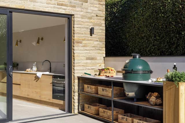 The outdoor kitchen with the Big Green Egg  by Nest Kitchens