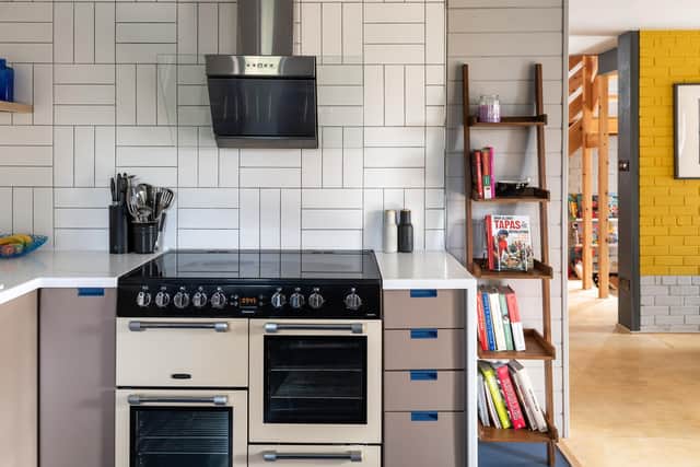The original kitchen unyts have been restored and revamped. Chris did the basket weave tiling.
