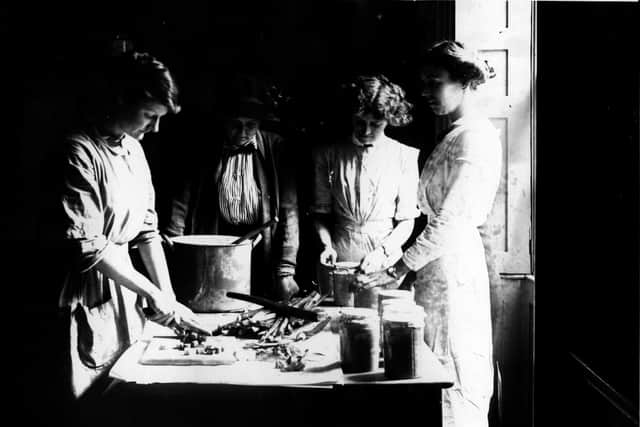 1st April 1914:  Lady Gwendolen Guinness watches students making rhubarb jam at the Rupert Guinness Training Farm for Women, Hoebridge Farm, Woking. The school is designed for women of the educated classes who intend to emigrate and join brothers and husbands working overseas.  (Photo by Topical Press Agency/Getty Images)
